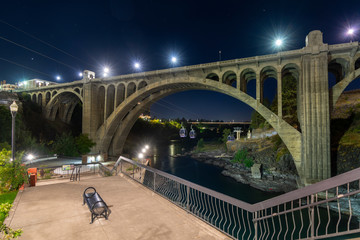 Late night at Spokane Falls along the river with the skyride gondolas, the river, cityscape and the...