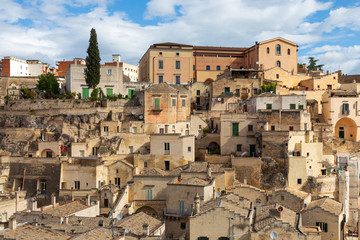 Obraz premium Italy, Basilicata, Province of Matera, Matera. Old stone buildings on a steep hillside.