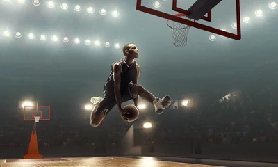 Fotobehang African american basketball player in action on a floodlit court. Slam dunk  © TandemBranding