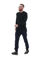 bearded man in a black sweater, stepping forward .isolated on white