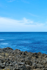 Fototapeta na wymiar Seaside Cliff and Blue Sky