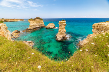 Italy, Apulia, Province of Lecce, Melendugno. The Faraglioni (limestone stacks) of Torre...