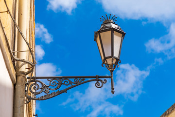 Fototapeta na wymiar Italy, Apulia, Province of Lecce, Lecce. Wrought iron street light.