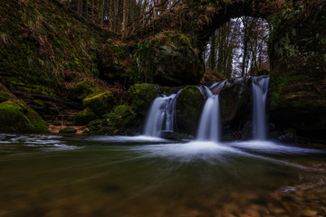 The Schiessent&uuml;mpel is a small and picturesque waterfall on the Black Ernz river. Mullerthal - Luxembourg&rsquo;s Little Switzerland.
