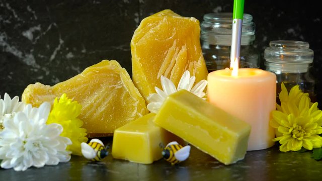 Honeybees related product, beeswax, cera alba, which is a natural wax with many household uses including lip balm, skin moisturizer, cooking, candles and furniture polish.