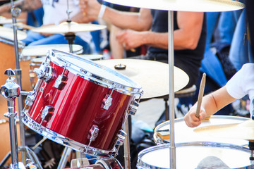 Fototapeta na wymiar Street music band plays on various drum kits