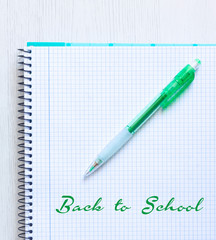 BOLYGRAPH ON NOTEBOOK ON WOOD BACKGROUND. BACK TO SCHOOL