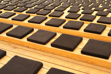 Fototapeta premium Ottomans seats on wooden stairs