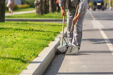 A sweeper cleans streets of trash