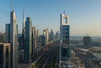 Fototapeta na wymiar Dubai from above(43th floor). Dubai skyline on sunset. United Arab Emirates, may 2019