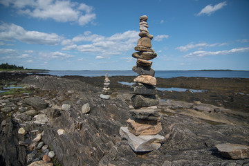 Balanced tower of rocks on the coast 