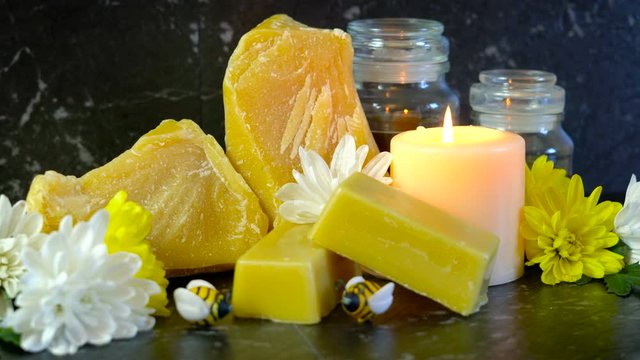 Honeybees related product, beeswax, cera alba, which is a natural wax with many household uses including lip balm, skin moisturizer, cooking, candles and furniture polish.