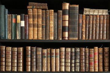 old books on wooden shelf