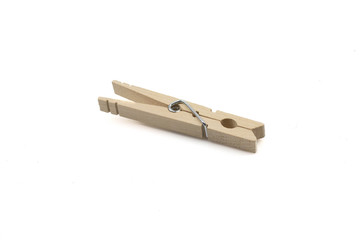 A close up macro shot of a wooden clothespin isolated on a clean, white background