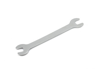 A macro, close up photo of a steel combination wrench isolated on a white background