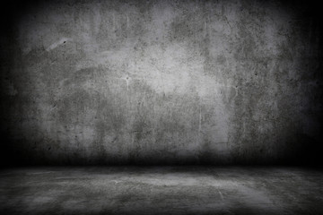 Grunge interior room with concrete wall and floor. Empty concrete space.