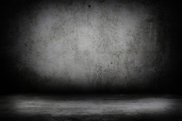 Grunge interior room with concrete wall and floor. Empty concrete space.