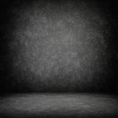 Grunge interior room with concrete wall and floor. Empty concrete space.