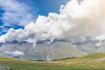 Fototapeta premium Mountains in Georgia in the rays of the setting sun