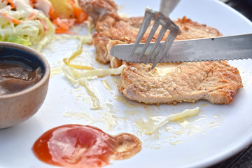 Pork steak with vegetable salads and sauces is a delicious and popular dish.