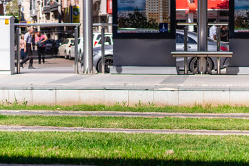 a shoot from tram station with green grasses