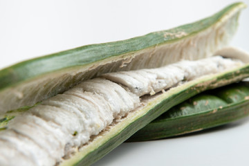 Guaba or cuaniquil: fresh South American fruit on white background