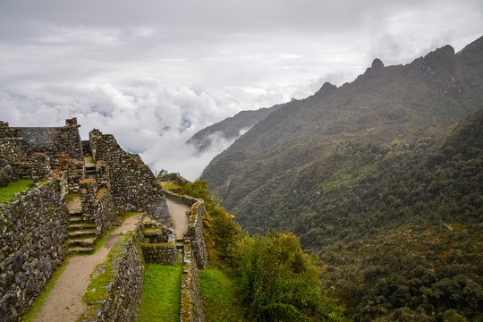 Sayacmarca an ancient Inca ruins along the Inca trail&nbsp;that overlooks a low-hanging clouds on the dense and green mountains