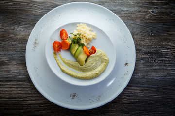 top view on rice and vegetables modern decorated with green sauce
