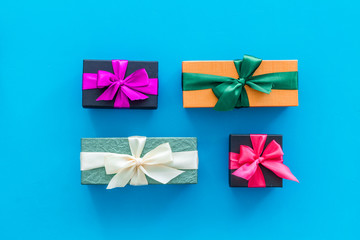 boxes with presents for holiday on blue background top view