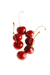 Fresh cherries on white background. Juicy summer berry close-up.