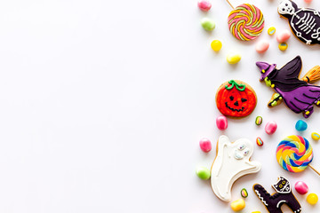 Fototapeta na wymiar Creepy cookies for halloween treat frame on white background top view space for text
