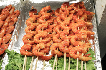 Marinated shrimps prawn on bamboo skewers