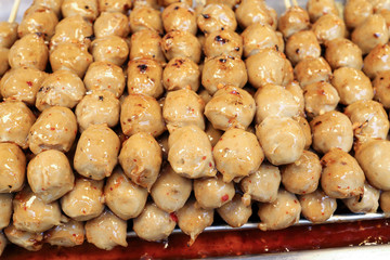 sausage meat ball on skewer selling at street stall