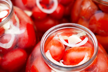 pickled (canned) red tomatoes in jars