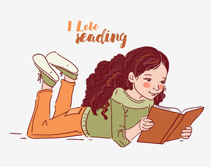 Cute little girl reading a book