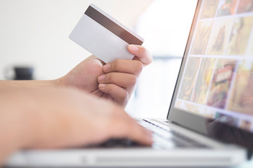 Credit card use to shopping by Business women with telephone and lab top computer.
