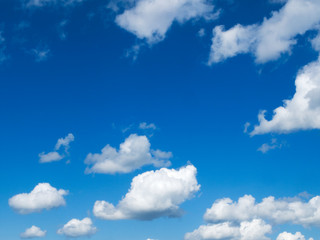 Cumulus humilis clouds with flat bottoms and fluffy tops in a blue sky on a mostly sunny day.