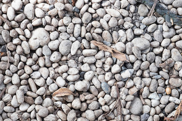 The stones on the floor of the natural way close up background .