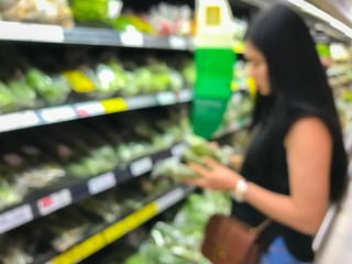 Blur woman shopping at food department