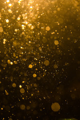 Abstract gold bokeh with black