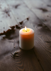 White Candles Burning On Wooden Tabletop