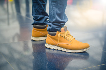 pair of boots on wooden background