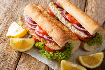 Hot Balik Ekmek fish sandwich with grilled mackerel served with lemon closeup. horizontal