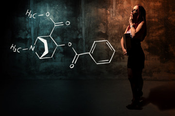 Sexy girl or secretary or female student presenting handdrawn chemical formula of cocaine