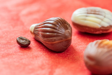 Swiss chocolate on red paper background.