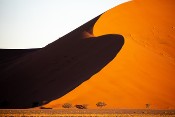 Deep colors of sand dunes during sunset. Sossusvlei, Namibia.