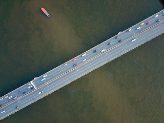 Aerial view of Traffic on the bridge over the Chao Phraya River, Bangkok, Thailand. Top view.