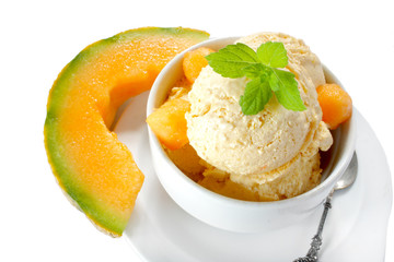 Fresh melon ice cream with melon and melissa isolated on white background 
