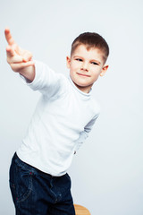 little cute boy on white background gesture smiling close up, lifestyle people concept