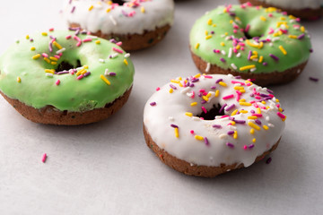 White and green Sprinkled delicious doughnuts.
